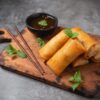 Spring rolls on the wood plate